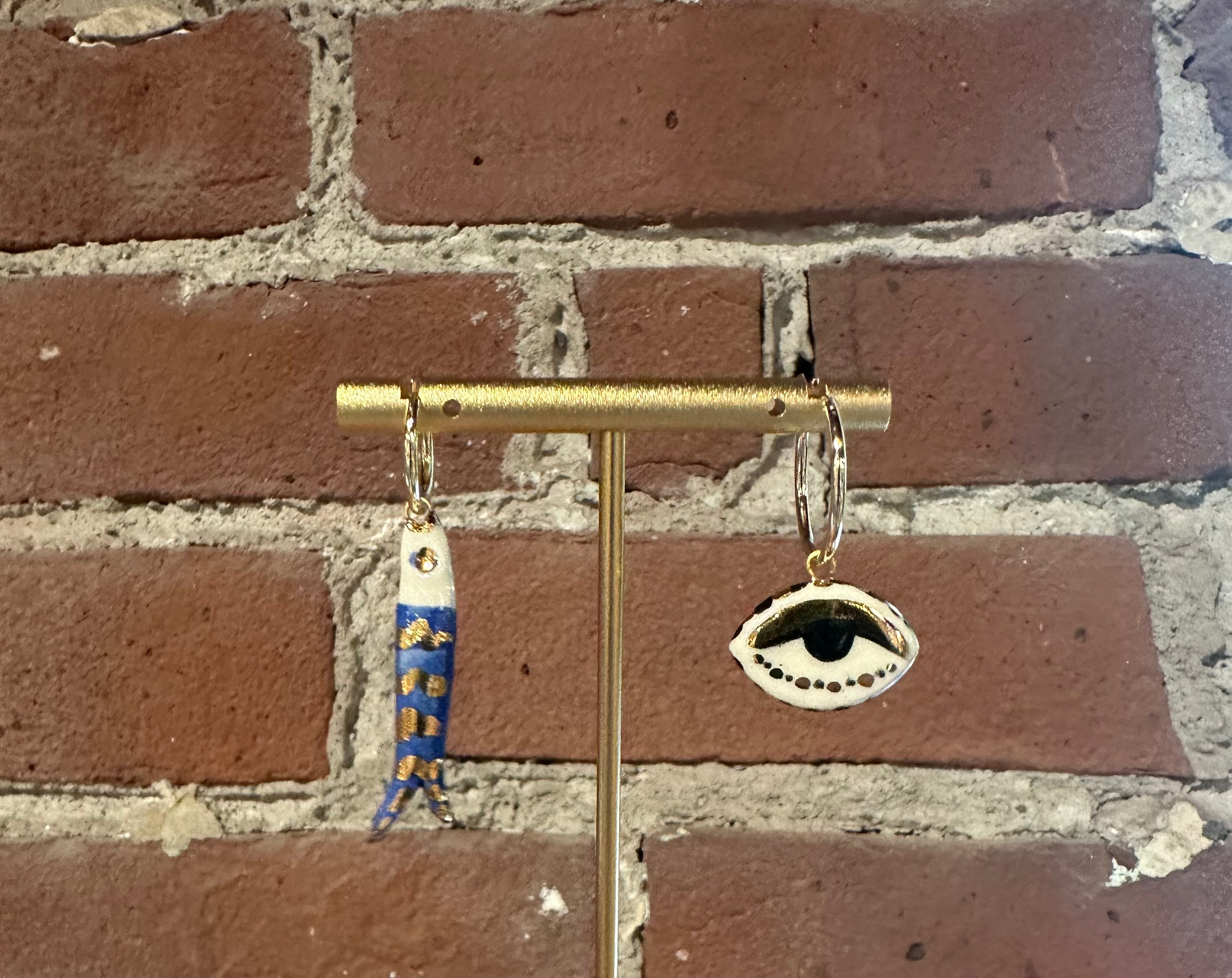 Mismatched Catch earrings (fish and eye)