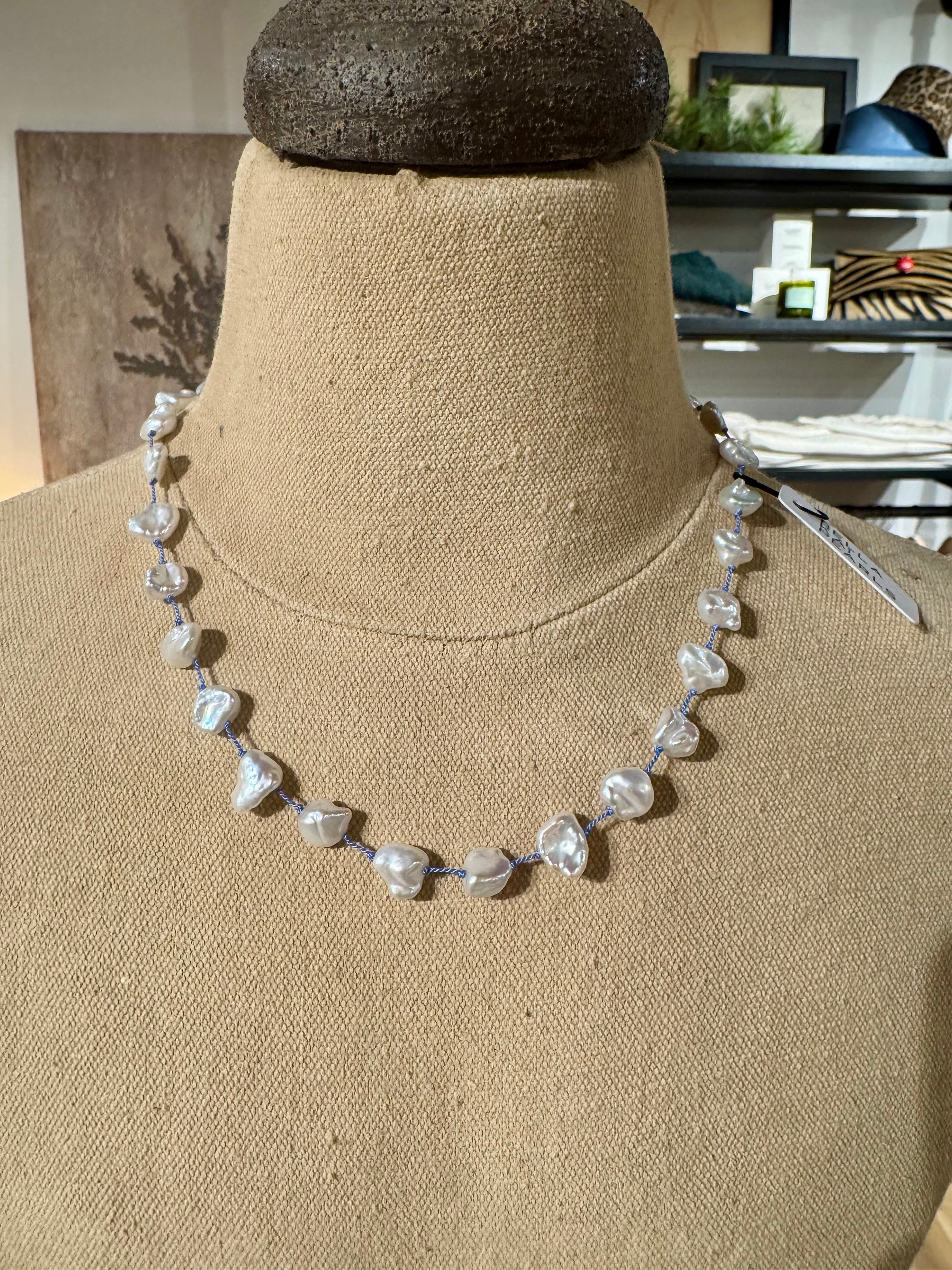 Keshi pearl on blue silk