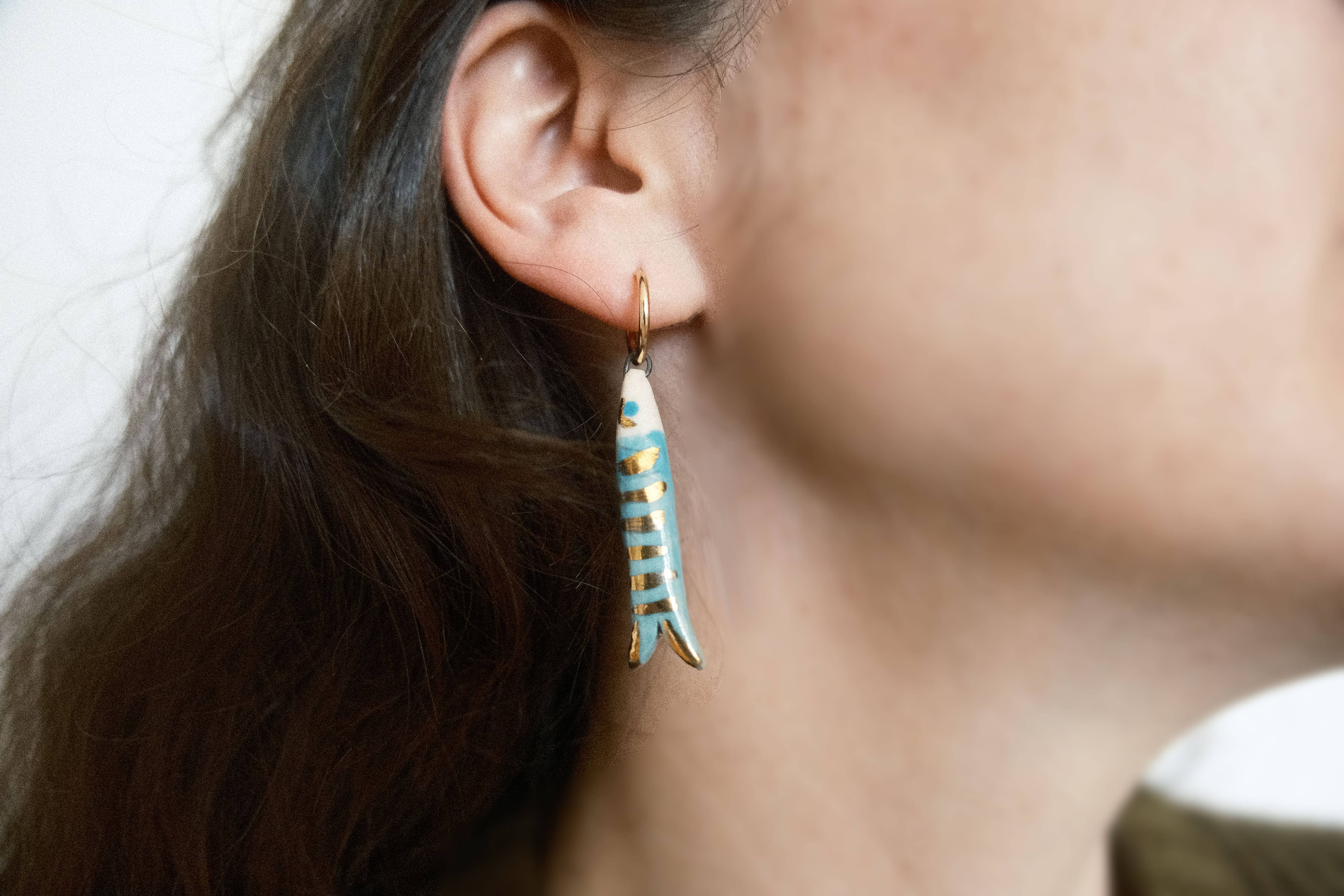 Mismatched Catch earrings (fish and eye)